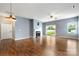 Spacious living room with hardwood floors, fireplace, and access to backyard at 13012 Hunting Birds Ln, Charlotte, NC 28278