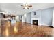 Open concept living room with hardwood floors and lots of natural light at 13012 Hunting Birds Ln, Charlotte, NC 28278
