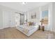 Bright bedroom featuring a large bed, neutral color palette, and a barn door at 13097 Arnold Palmer Cir # 844, Lancaster, SC 29720