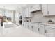 Modern kitchen featuring white cabinetry, stainless appliances, and an island with bar stool seating at 13097 Arnold Palmer Cir # 844, Lancaster, SC 29720