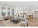 Open concept living area with a kitchen, cozy seating, natural light, and modern decor at 13097 Arnold Palmer Cir # 844, Lancaster, SC 29720