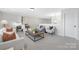 Bright living room featuring stylish furniture, decor, and comfortable seating arrangement at 13097 Arnold Palmer Cir # 844, Lancaster, SC 29720