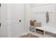 Stylish mudroom with shiplap walls, a built-in bench, and storage at 13097 Arnold Palmer Cir # 844, Lancaster, SC 29720