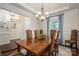 Elegant dining room featuring a chandelier, crown molding, and natural light at 13103 Union Square Dr, Huntersville, NC 28078