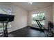 Bright exercise room with windows and equipment at 13103 Union Square Dr, Huntersville, NC 28078