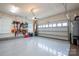 Well-organized garage with epoxy flooring, storage solutions, and space for vehicles and projects at 13103 Union Square Dr, Huntersville, NC 28078