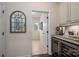 Hallway with coffee bar, wine fridge and view to sunroom at 13103 Union Square Dr, Huntersville, NC 28078