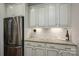 Bright kitchen with granite countertops, stainless steel appliances, and white cabinetry at 13103 Union Square Dr, Huntersville, NC 28078