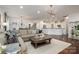 Spacious living room featuring hardwood floors, an open layout, and stylish modern decor at 13103 Union Square Dr, Huntersville, NC 28078