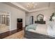 Comfortable main bedroom suite with rug, dark furniture and an en-suite bathroom at 13103 Union Square Dr, Huntersville, NC 28078