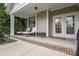 Covered patio offering a comfortable seating area with chaise lounges for relaxation at 13103 Union Square Dr, Huntersville, NC 28078