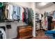 Walk-in closet with custom shelving, hanging rods, dresser and ample storage space at 13103 Union Square Dr, Huntersville, NC 28078