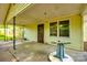 This back porch with siding is partially covered with a door and windows at 1430 Bose Ave, Rock Hill, SC 29732