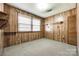Bedroom with a wood-paneled wall, window, and closet at 1430 Bose Ave, Rock Hill, SC 29732