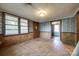 An empty room featuring wood-paneled walls, good light, and potential for various uses and customization at 1430 Bose Ave, Rock Hill, SC 29732