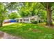 Well-manicured front yard featuring a charming home with a covered carport and lush greenery, creating a cozy atmosphere at 1430 Bose Ave, Rock Hill, SC 29732