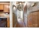 Hallway featuring wood paneling, plenty of storage, and leading to additional rooms in the home at 1430 Bose Ave, Rock Hill, SC 29732