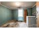 This laundry room features a window, a utility sink, and a washer at 1430 Bose Ave, Rock Hill, SC 29732