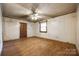 Spacious living room with hardwood floors, a ceiling fan, and a bright window, ready for personal touches at 1430 Bose Ave, Rock Hill, SC 29732