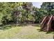 Lush, green backyard with wooden deck and stairs offers a tranquil outdoor space at 145 Meadow Pond Ln, Mooresville, NC 28117
