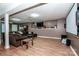 Spacious finished basement with a home theater, game area, and comfortable seating, perfect for Gathering fun at 145 Meadow Pond Ln, Mooresville, NC 28117