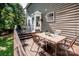 Expansive wooden deck with outdoor dining set, great for entertaining and relaxation at 145 Meadow Pond Ln, Mooresville, NC 28117