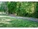 Scenic walking path surrounded by lush greenery and mature trees at 145 Meadow Pond Ln, Mooresville, NC 28117