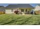 Large, green backyard with covered patio ideal for outdoor living and entertaining at 1488 Meadow Glen Ln, Rock Hill, SC 29730