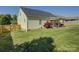 Well-maintained backyard with a covered patio, lush grass, and privacy fence at 1488 Meadow Glen Ln, Rock Hill, SC 29730