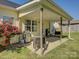 Covered patio featuring an outdoor cooking and dining area surrounded by green grass at 1488 Meadow Glen Ln, Rock Hill, SC 29730