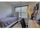 Comfortable bedroom with natural light from the window, a twin bed, and a stylish desk at 1488 Meadow Glen Ln, Rock Hill, SC 29730