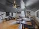 Spacious bonus room featuring a large TV, a ceiling fan, and a sectional sofa at 1488 Meadow Glen Ln, Rock Hill, SC 29730