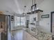 This is a kitchen with wood look floors, granite countertop island, and modern lighting at 1488 Meadow Glen Ln, Rock Hill, SC 29730