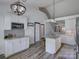 Bright kitchen with granite countertops, island, and modern appliances at 1488 Meadow Glen Ln, Rock Hill, SC 29730