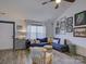 Bright living room featuring a comfortable sofa, stylish decor, and wood-look floors at 1488 Meadow Glen Ln, Rock Hill, SC 29730