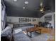 Bright living room with hardwood floors, dark ceiling, and comfortable seating area and home office at 1488 Meadow Glen Ln, Rock Hill, SC 29730