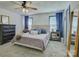 This is a main bedroom with a ceiling fan, two windows, bedside tables, and carpet at 1488 Meadow Glen Ln, Rock Hill, SC 29730