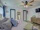 This is a main bedroom with a ceiling fan, two doors, and a mirror at 1488 Meadow Glen Ln, Rock Hill, SC 29730