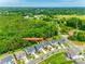 Neighborhood aerial view showcasing the home's location with tree-lined streets and lush surroundings at 15312 Ravenall Dr, Huntersville, NC 28078