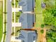 Aerial view highlighting the home's roof, neighboring properties, and manicured lawns at 15312 Ravenall Dr, Huntersville, NC 28078