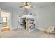 Cozy bedroom featuring a unique bunk bed setup, ceiling fan, and ample lighting at 15312 Ravenall Dr, Huntersville, NC 28078