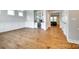 Open-concept dining area with hardwood floors, a bar, and easy access to the living room at 15312 Ravenall Dr, Huntersville, NC 28078