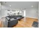 Spacious open-concept living area with hardwood floors, recessed lighting, and seamless kitchen access at 15312 Ravenall Dr, Huntersville, NC 28078