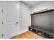 Functional mudroom featuring a built-in bench with storage, ideal for organization and entryway convenience at 15312 Ravenall Dr, Huntersville, NC 28078