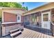 Back deck with a hot tub and entrance to the screened porch at 1540 Neely Store Rd, Rock Hill, SC 29730