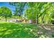 Large, well-maintained backyard with detached garage, sheds, and plenty of green space for activities at 1540 Neely Store Rd, Rock Hill, SC 29730