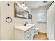 Well-lit bathroom showcasing a classic vanity, framed mirror, and shower with curtain at 1540 Neely Store Rd, Rock Hill, SC 29730