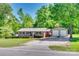 Charming brick home with well-maintained lawn, detached two-car garage, and inviting curb appeal at 1540 Neely Store Rd, Rock Hill, SC 29730