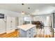 Open kitchen with a large island, storage, and view to dining area at 1540 Neely Store Rd, Rock Hill, SC 29730