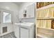 Functional laundry room with modern appliances, storage cabinets, and stylish flooring at 1540 Neely Store Rd, Rock Hill, SC 29730